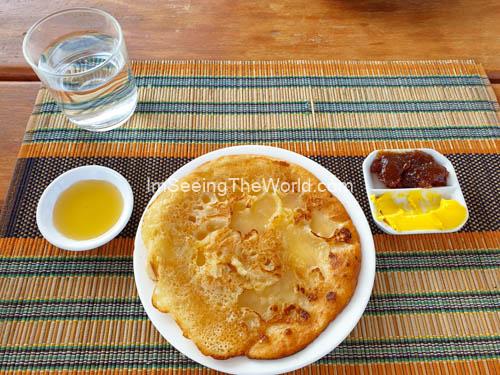 pancake, strawberry jelly, and heavy butter serverd at myanmar hotel in bagan, myanmar